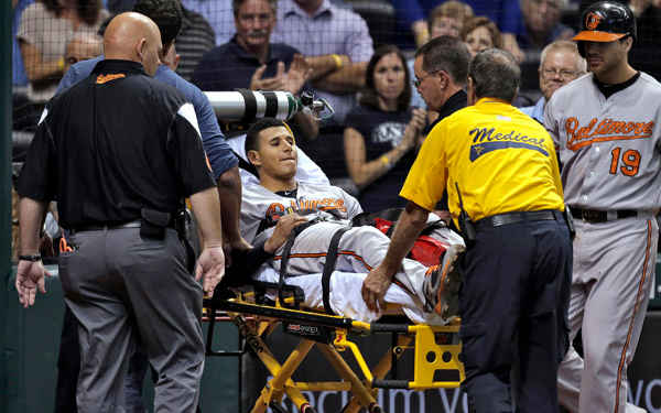Orioles 3B Manny Machado was taken off on a stretcher after injuring his knee. (AP Photo/Chris O'Meara)